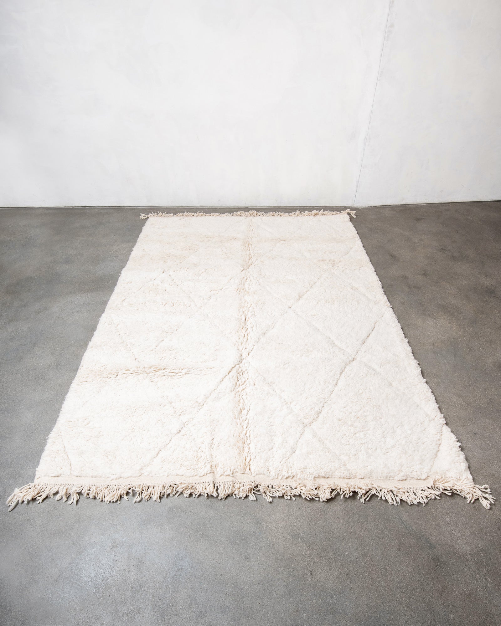 Modern, designer, handcrafted Berber rug from Morocco. Beniourain carpet with beautiful colours and patterns and fluffy wool texture.